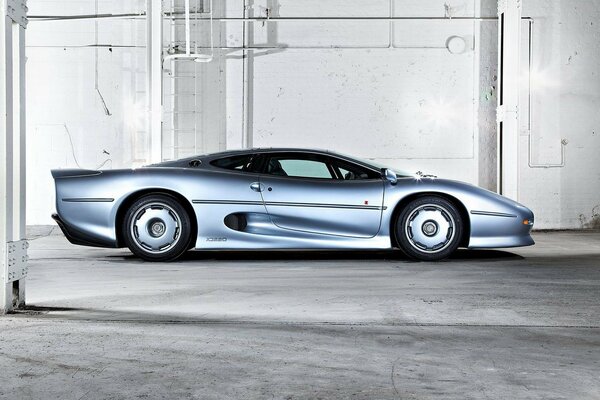 Jaguar blue metallic supercar side view