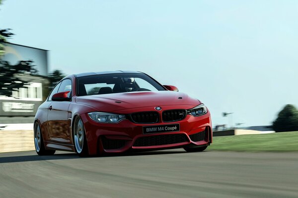 Bmw M4 coupé rojo en la carretera