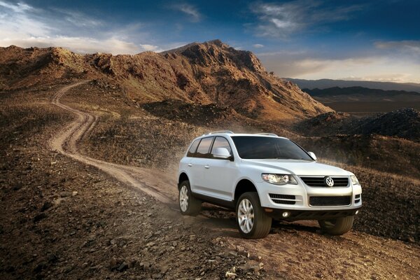 White Volkswagen on the background of mountains