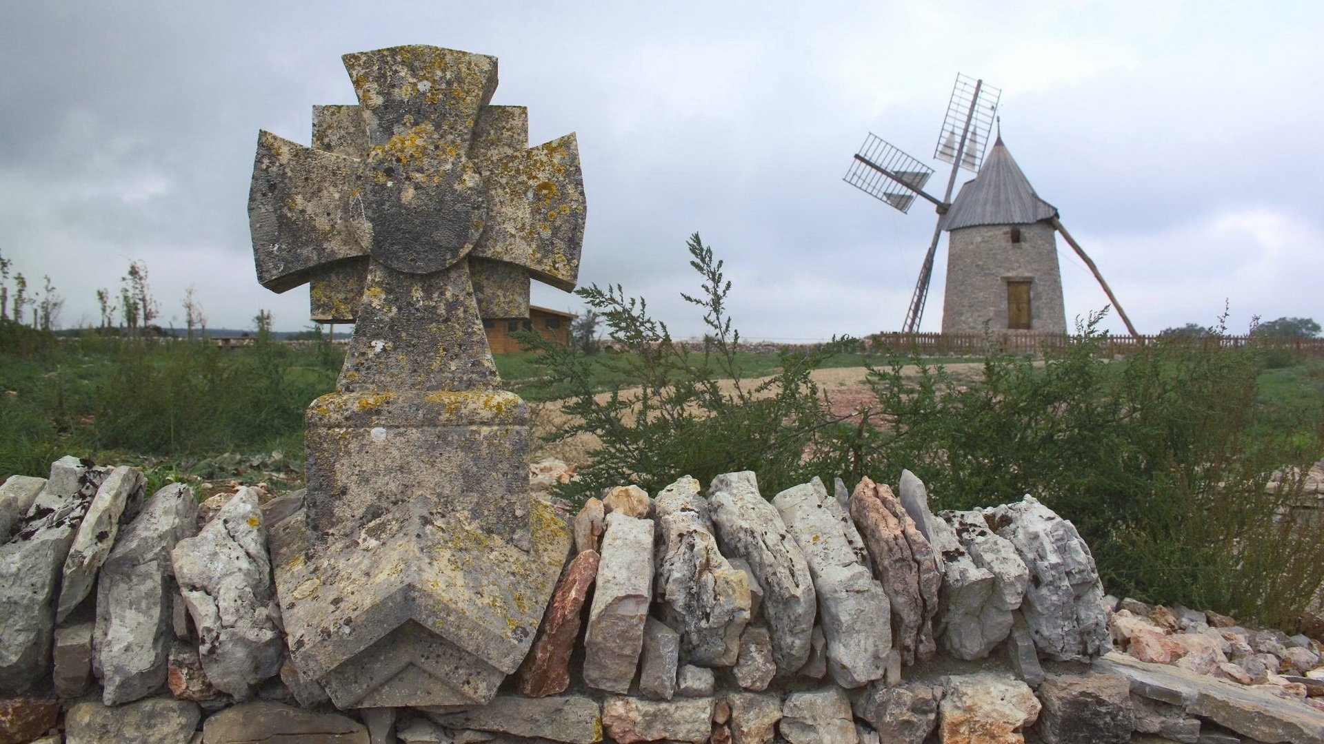 tone fence mill field clouds clouds bushes greenery windmill