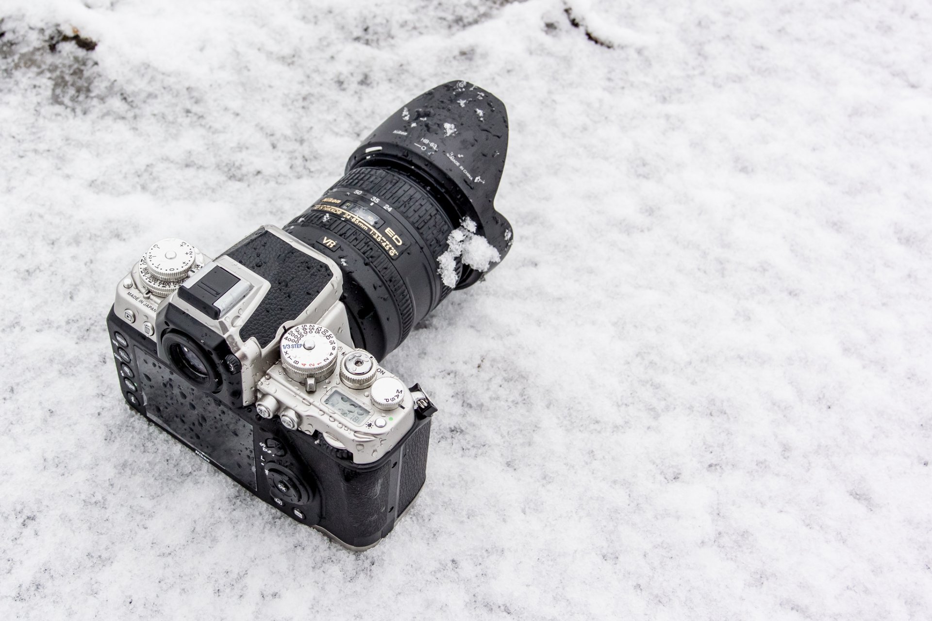 nikon 1 aw1 a camera lens winter snow background