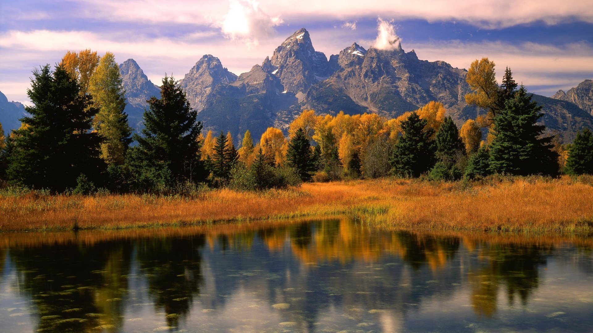 yellow grass unity autumn time lake mountains forest autumn reflection the colors of autumn grass foliage nature landscape rocks the sky clouds silence grace calm