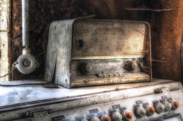 An old radio receiver full of cobwebs