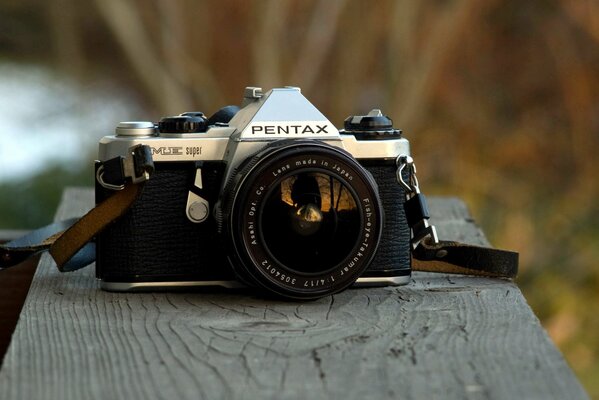 Camera on a piece of wooden beam