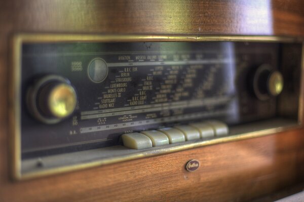 Wooden radio with plastic buttons