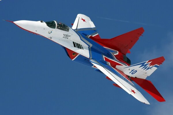 A white-blue-red plane is flying in the sky