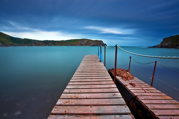 Wooden pier in the turquoise expanse