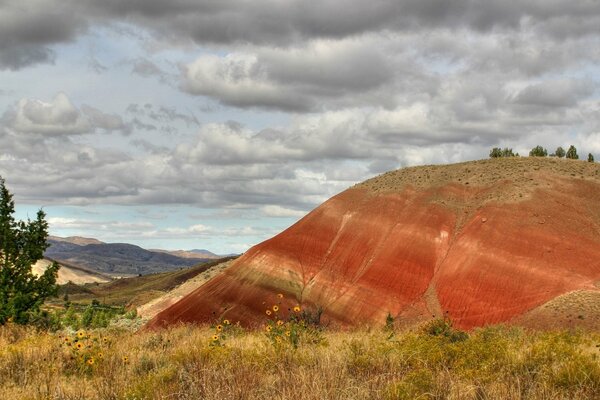 Flying landscape with red hill