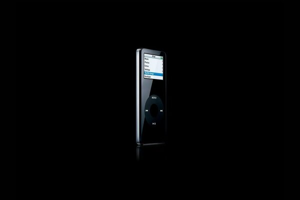 A black iPod hides in the dark