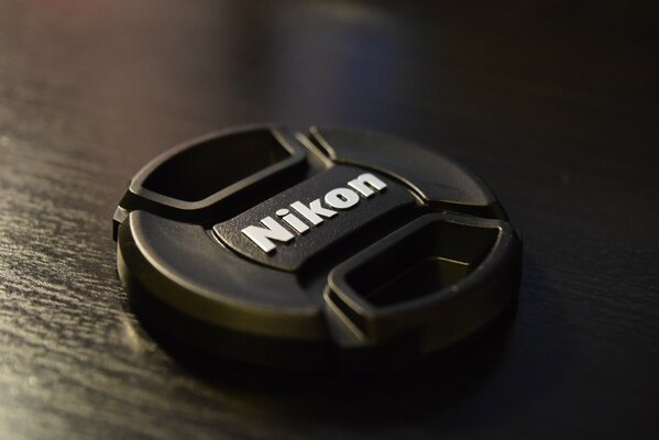 Nikon lens cap on the table