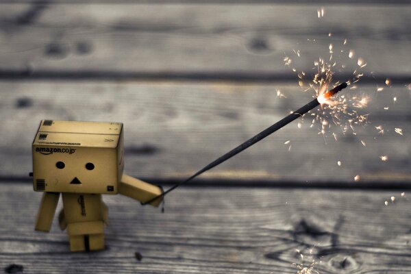 A cardboard robot, a very beautiful picture with a sparkler