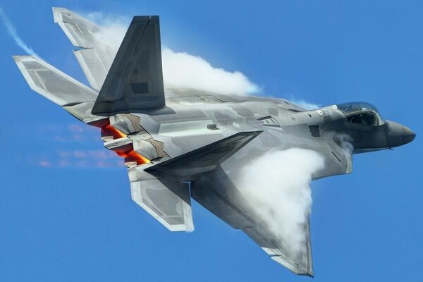 Fighter jet on a blue sky background