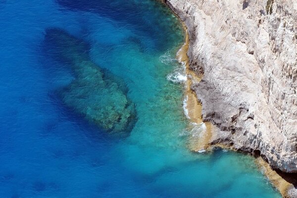 Cliff by the sea rock and water