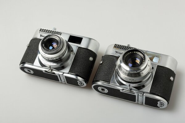 A pair of macro cameras on a gray background