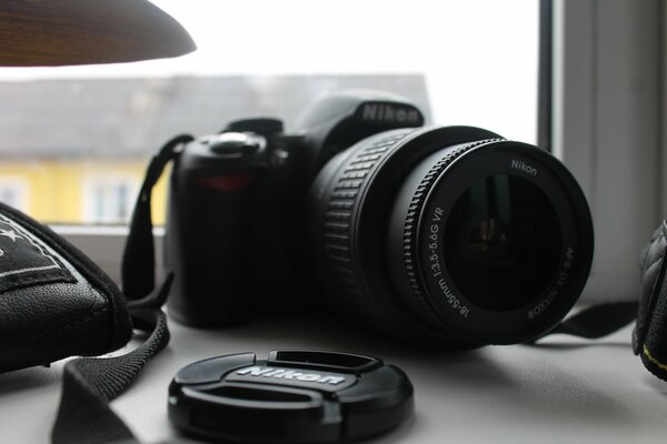 Camera on the windowsill with a view of the house