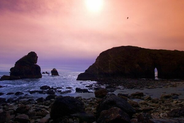 Sunset on the rocky seashore