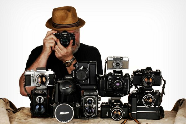 A man demonstrates one of the many cameras