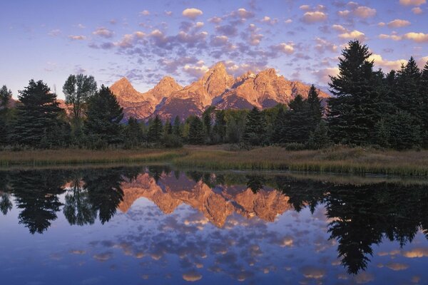 Light clouds are reflected in the waters of the lake