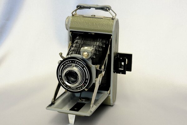 Kinax - cadet, camera of the past on a light background
