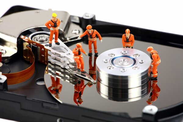 Miniature workers on hard disk pancakes