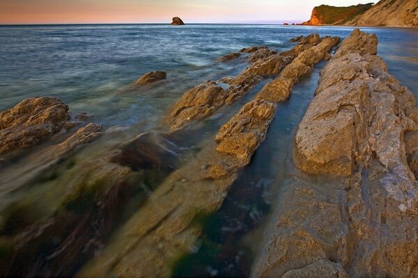 Stone slabs washed by the salt water of the surf