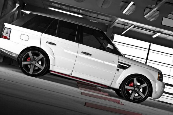 White car with black roof range rover