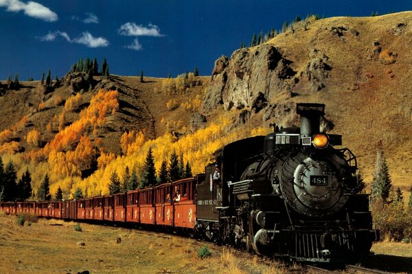 Retro train on the background of autumn nature