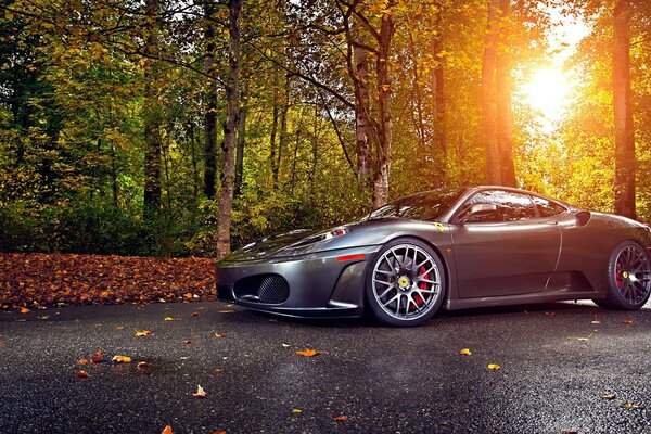 Beautiful sunset on the background of an Italian supercar