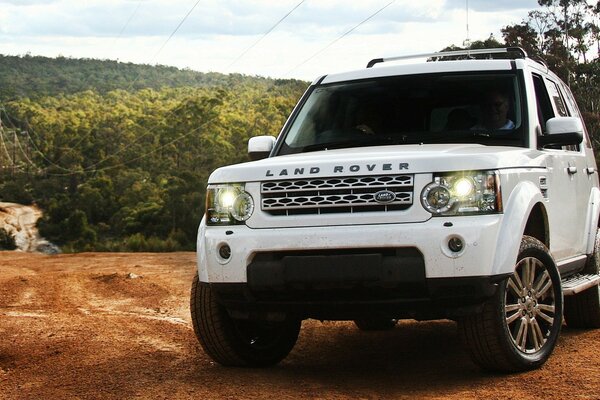 SUV conquers the top of the hill