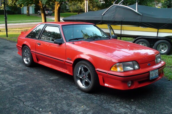 The 1993 Ford Mustang sports car is red