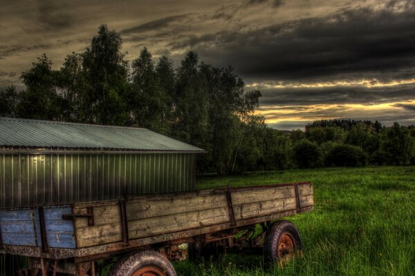 An old cart against the sky in the village