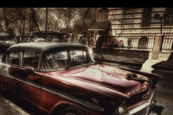 A quiet street, an old and beautiful city. And there is a beautiful car on the side of the road, amazing feelings