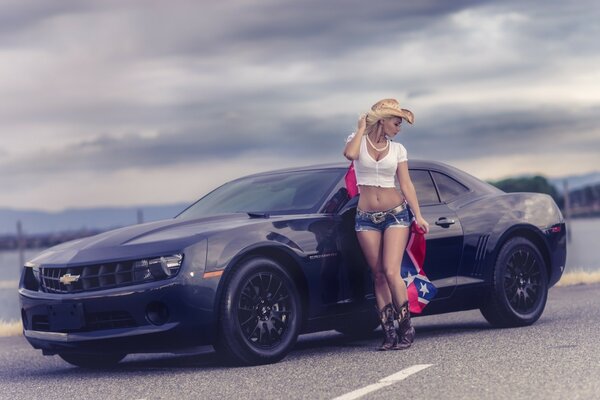 Black Mustang and blonde in boots