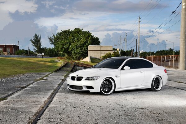 White bmw car on the road