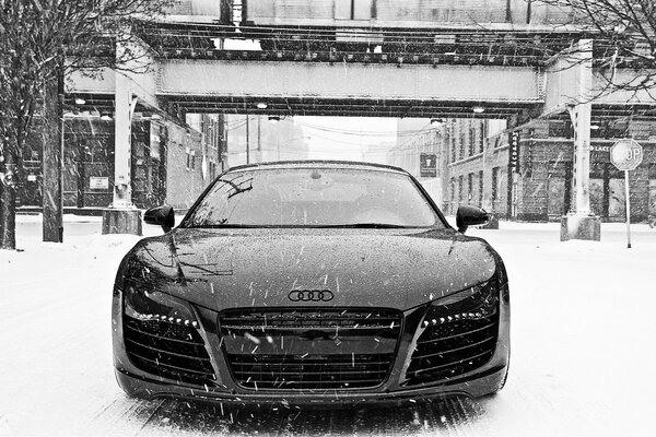 Black Audi car in a snowy city