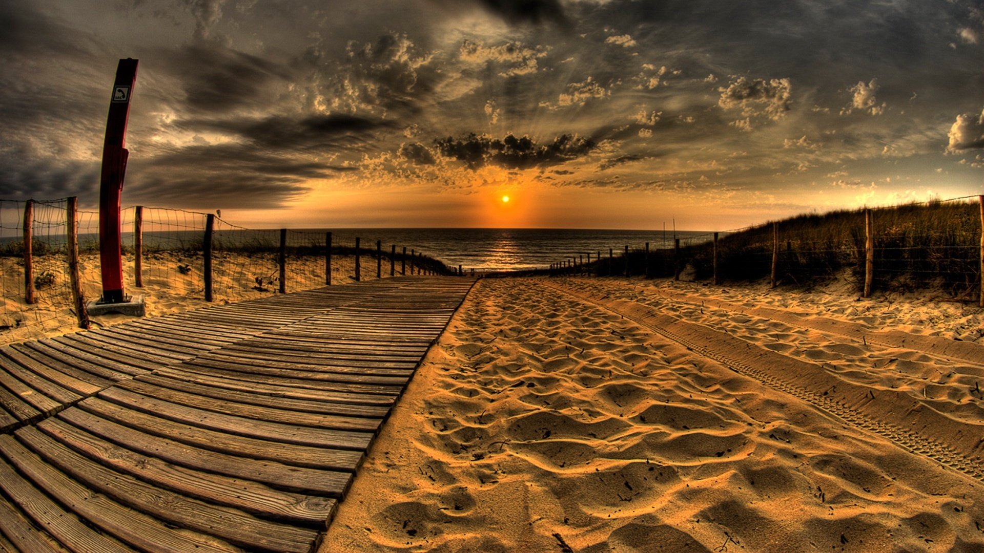 watch it on the sand wooden walkway sea sunset beach clouds horizon sand the evening