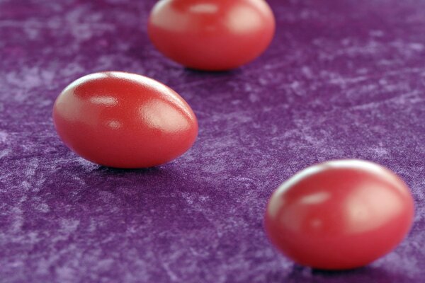 Red eggs on a purple napkin