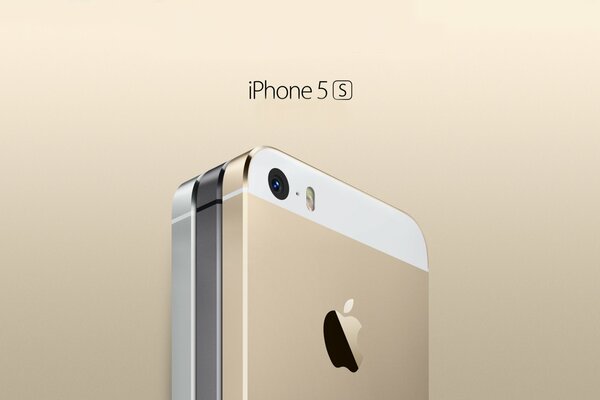 Téléphone portable dans les tons or et gris. Pomme