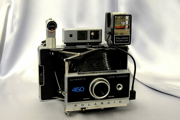 The image of the polaroid camera four hundred and fifty on a white background