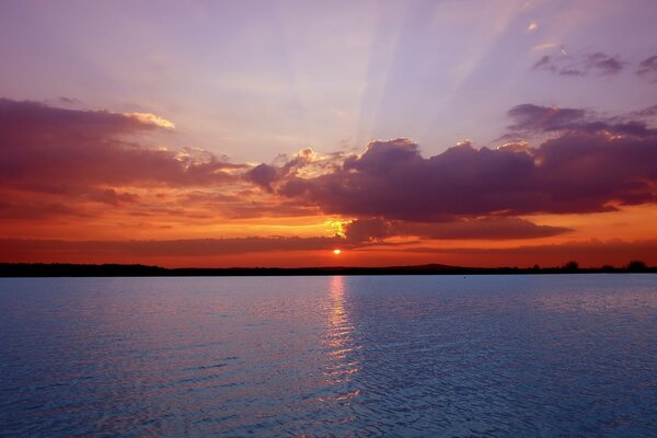 The sun goes below the horizon during sunset