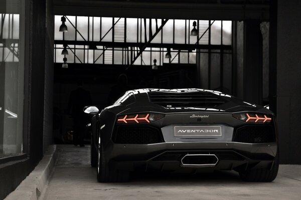 The back of the lamborghini aventador is black