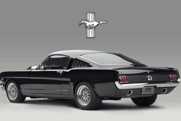 Black ford mustang on grey background