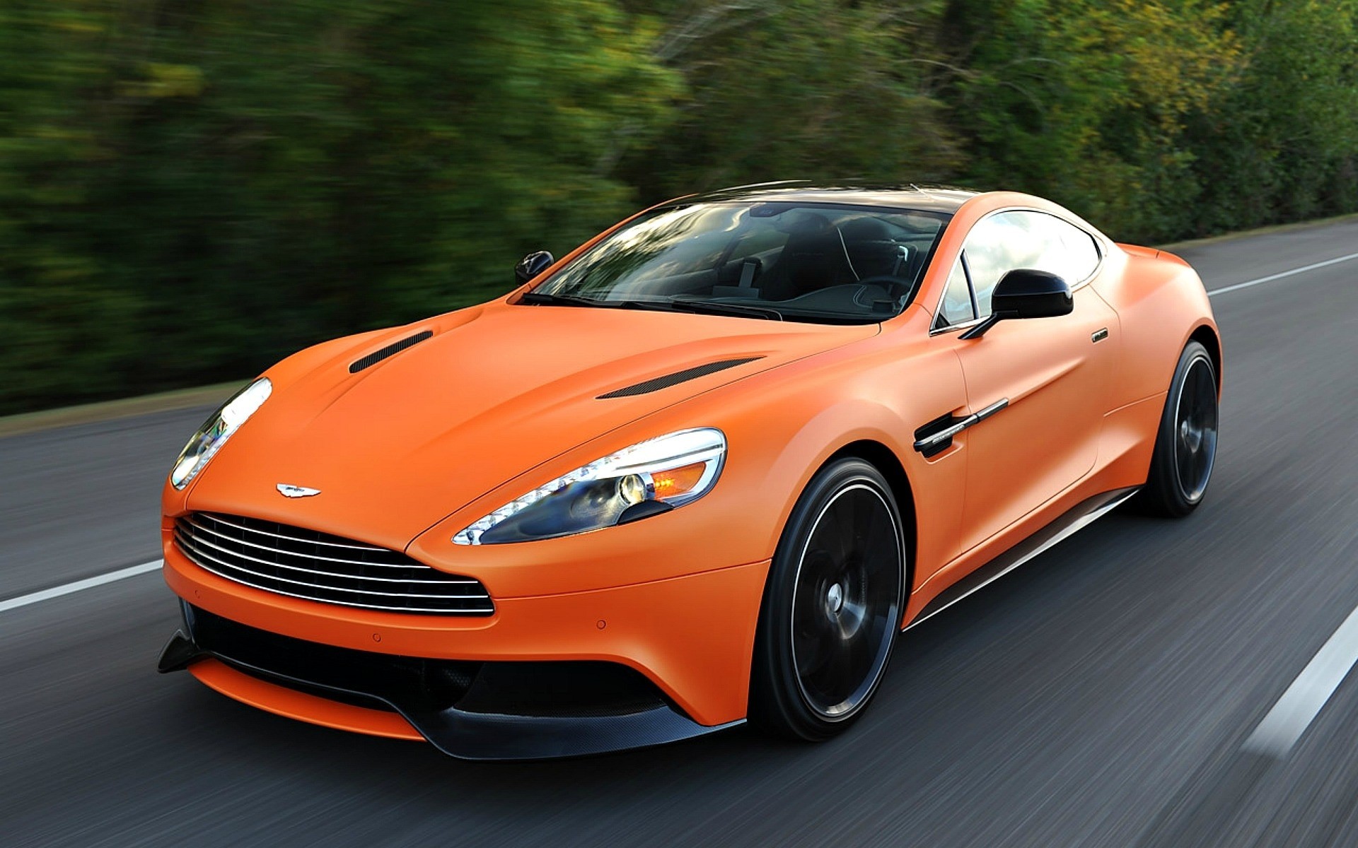 orange aston martin car