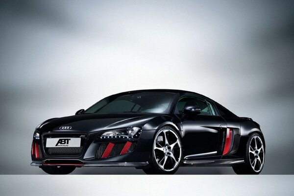 Black audi r8 with red details on a gray background