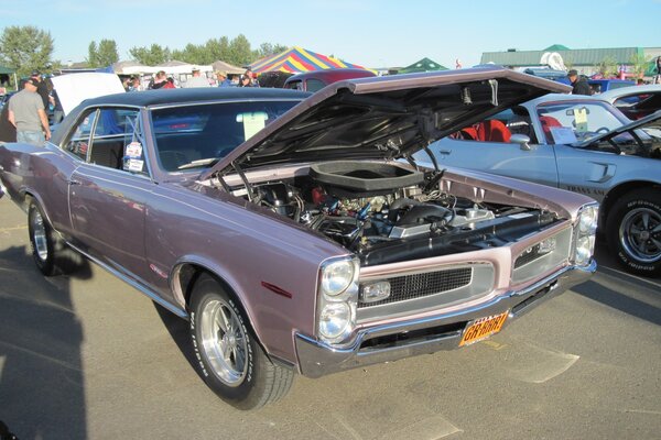 Purple retro car with raised hood