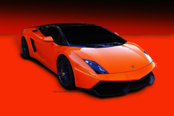 Orange car with a low landing on a red background