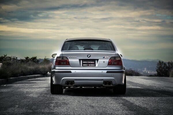 M5 car on the background of the road and the cloudy sky of the sky