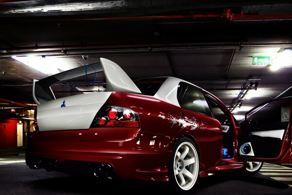 Red handsome mitsubishi in the underground parking lot