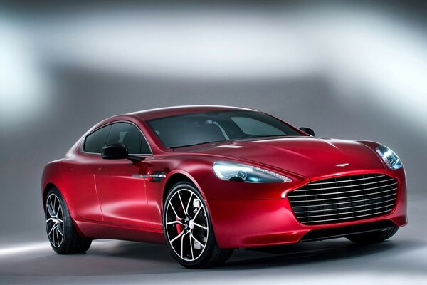 Aston martin 2014 rojo sobre fondo gris y blanco