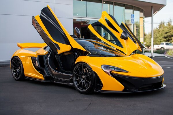 Yellow supercar with open doors